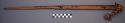 Long wooden stick, pointed on one end raffia wrapped handle