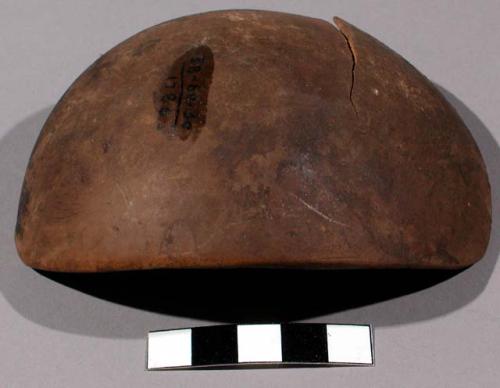 Piece of gourd (brown) - used for smoothing off earthen kettles before firing