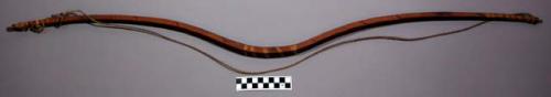 Bow. Pronounced double S shape. Sinew backed w/ sinew stringing and lashi