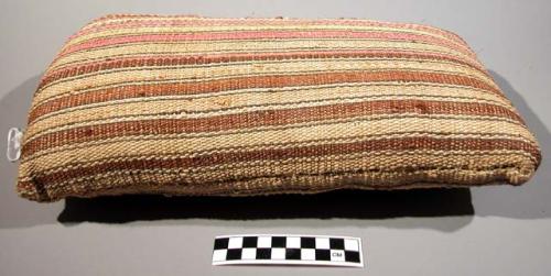 Woven pillow made from chambira, stuffed with wild cotton(?)