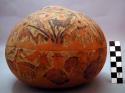 Complete gourd with painted and carved designs of men with llamas, +