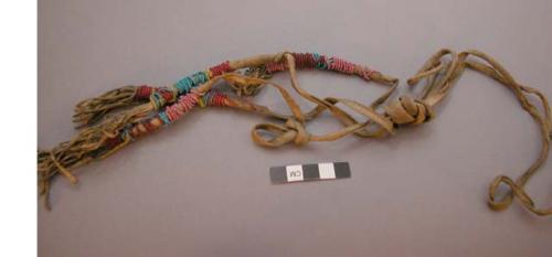 Sioux garters. Strips of buckskin w/ 2 decorated portions consisting of pink, bl