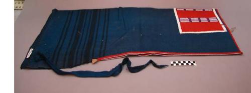 Pair of leggings made from a blue blanket. Red flannel trim on edges