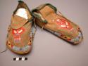 Pair of Sioux moccasins. Hard soles w/ leather uppers. Triangular tongue sewn on