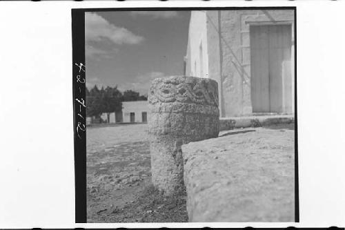 Carved altar in front of store in plaza.