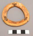 Ivory bracelet, in three parts held together with strips of soft sinew