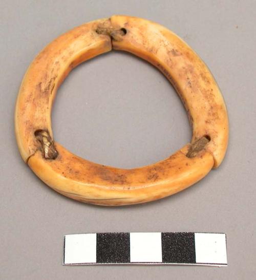 Ivory bracelet, in three parts held together with strips of soft sinew