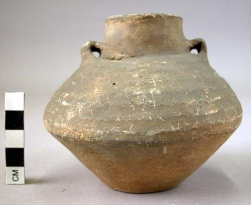 Ancient vessel; vase.  Handles or ears perforated.