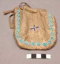 Skin pouch with blue bead decoration