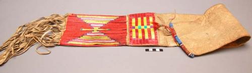 Pipe and tobacco case--skin decorated with small border of porcupine quills of v