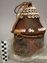 Milk container: carved wooden bottom; woven grass top covered with leather and d