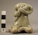 Ceramic figurine, seated woman w. infant, green glazed, head missing