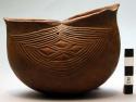 Wooden cup, carved sides