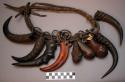 Cow charm - collar hung with knobs of wood, tusks of forest pig, +