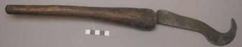 Bill hook, club-shaped handle with iron blade, worn thin from use (nkusu)