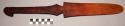 Paddle, carved wood, flared, handle w/ round & perforated end, chipped