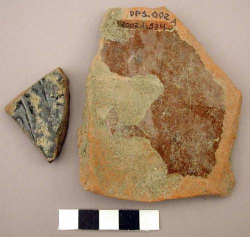 Ceramic body sherd, redware w/ area of brown glaze, thick