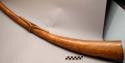 One ivory horn carved from elephant tusk, and has circular design
