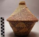 Small basket with lid, checkered triangular motif in purple; cone shaped top (mb