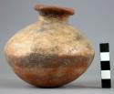 Pottery jar, base red, upper zone white with black ornamentation