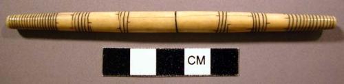 Ivory string tightener with incised linear design