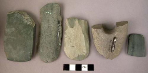 Ground stone axe, adze and axe fragments, green, polished, 1 perforated