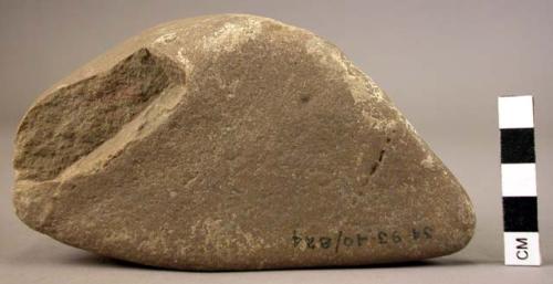 Pebble, triangular, faceted - possibly used in rubbing