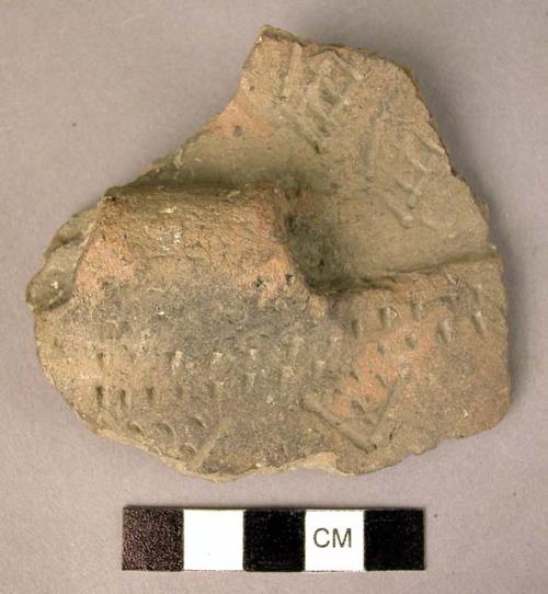 Sherd of profilated pottery bowl, incised and stroked decoration