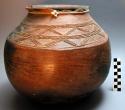 Red pottery vessel with incised designs. Nsuku