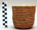 Basket with dried frogs