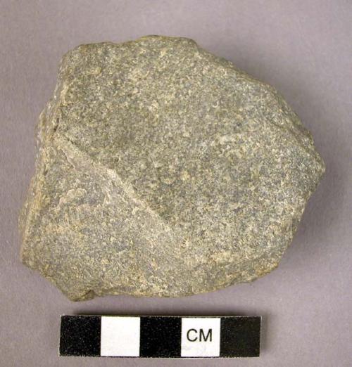 Quartzite flat pebble possibly used as a scraper