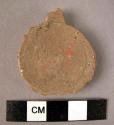 Ceramic base sherd, reworked into small perforator