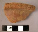 2 rim potsherds - red ware, interior of paste black