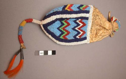 Skin pouch with bead decoration on lower half