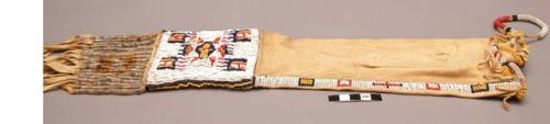 Beaded skin tobacco pouch - white background with blue, yellow & red bead design