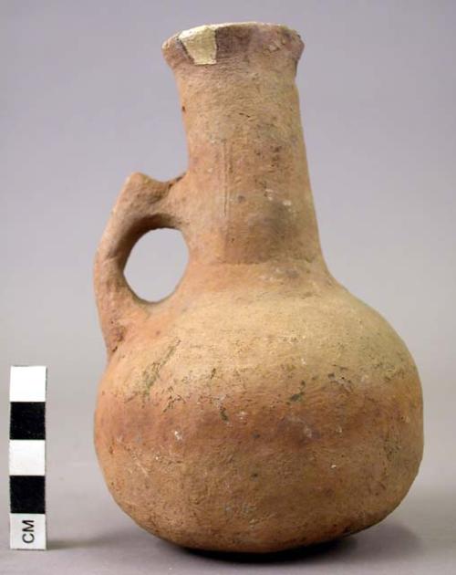 Single-handled, long, thin neck pottery jug