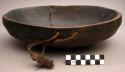 Bowl; carved wood; oval; rounded base & sides; straight rim; perf'd