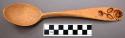 Wooden sofke spoon with burnt-in design (floral) on handle.