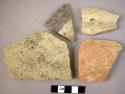 7 potsherds with incised decoration; 2 potsherds with ridges