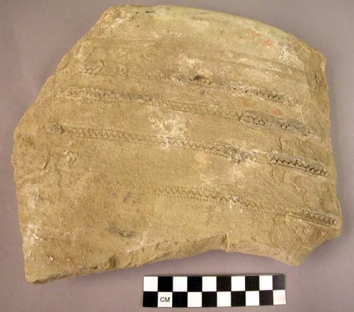 1 large potsherd with incised decoration
