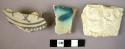 4 potsherds -- 1 plain, 1 incised, 2 painted (black with blue, and turquoise)