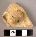 Ceramic body sherd, buff ware with red painted design, perforated lug handle