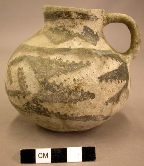 Black on white pottery jug