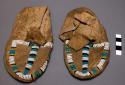 Pair of child's moccasins, possibly Sioux. Soft soles. Cloth edging at top