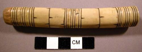 Needle case, tubular bone or ivory, carved grooves, incised & pigmented bands