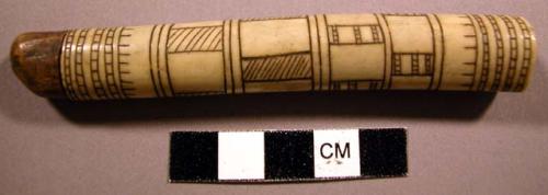 Needle case, tubular bone or ivory, incised & pigmented geometric design