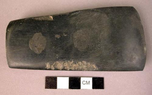 Ground stone axe, black, polished, thick, square butt, flared blade