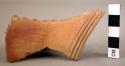 Ceramic handle sherd, orange burnished, row of raised design, incised