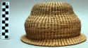 Coiled basketry hat with narrow brim
