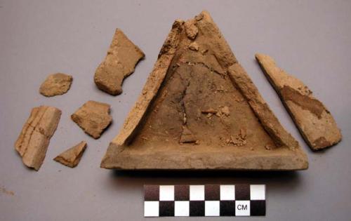 Triangular dish, grey mud